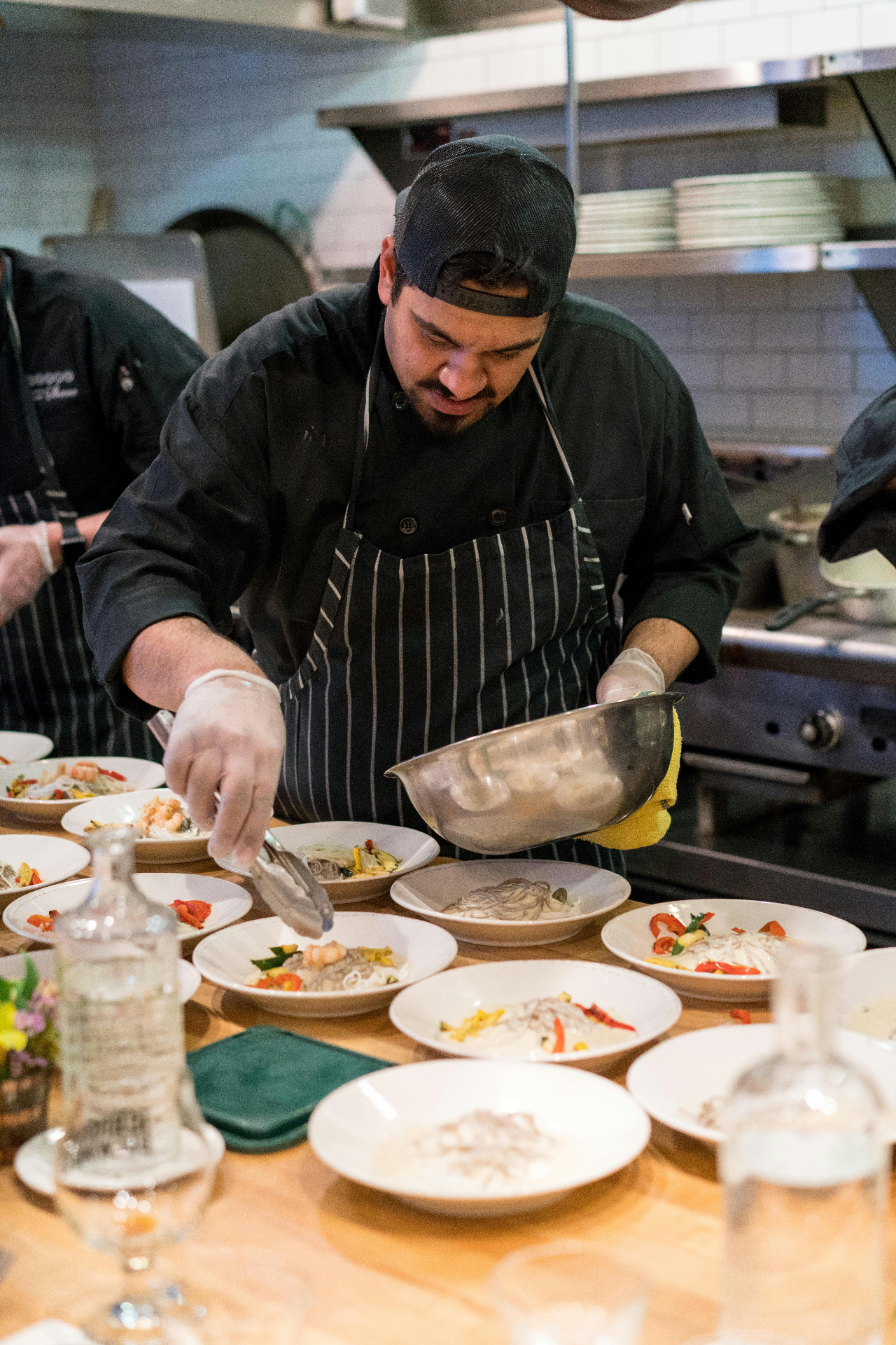 Chef plating dishes in the FuelOS kitchen